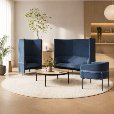 Contemporary living room with blue upholstered seating set around a round wood coffee table on a beige circular rug.